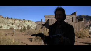 clint eastwood aiming 2 handguns in the outlaw josey wales