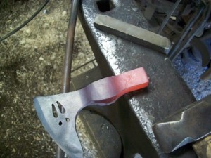 red hot bearded axe on the anvil
