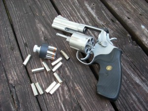 357 magnum with some spent brass and a speed loader