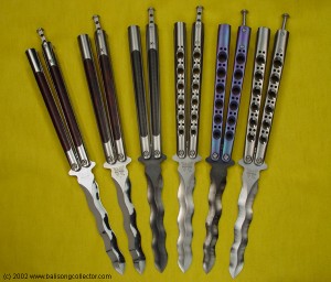 a collection of balisong knives with wavy blades