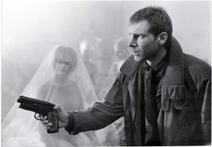 harrison ford in blade runner with his fictional gun