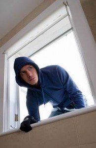 burglar breaking in through window
