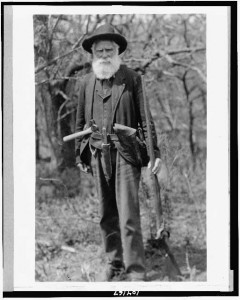 old man with hatchet, musket, and pistol