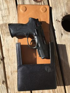 px4 storm emerging from a sneaky pete holster